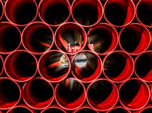Stockbild inom företag: construction, tube, red